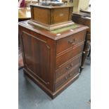 A mahogany pedestal filing cabinet.