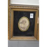 Print of a lady in a classical dress in a Verre Eglomise frame.