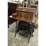 A Singer treadle sewing machine.