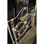 A Victorian style cream painted wrought iron double bed frame.