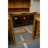 A gilt framed mirror.