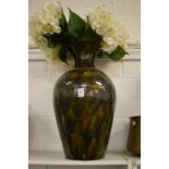 A large glazed pottery vase.