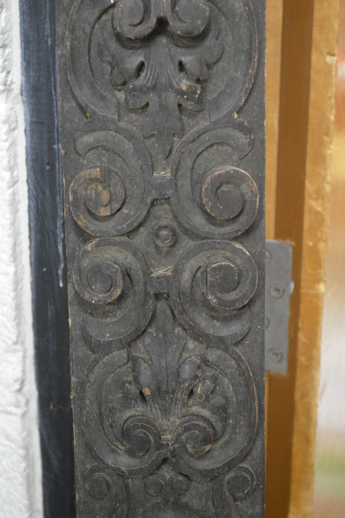 A tall narrow carved wood panel. - Image 2 of 2