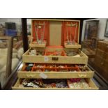 A good large jewellery box containing a quantity of costume jewellery.