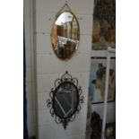 Two decorative mirrors.