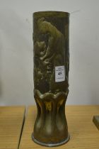 Trench Art, an embossed brass shell case depicting a woman gathering grapes.