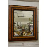 An 18th century style cushion framed mirror.