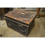 A tin trunk containing various old Persian and other carpets etc (sold as seen).