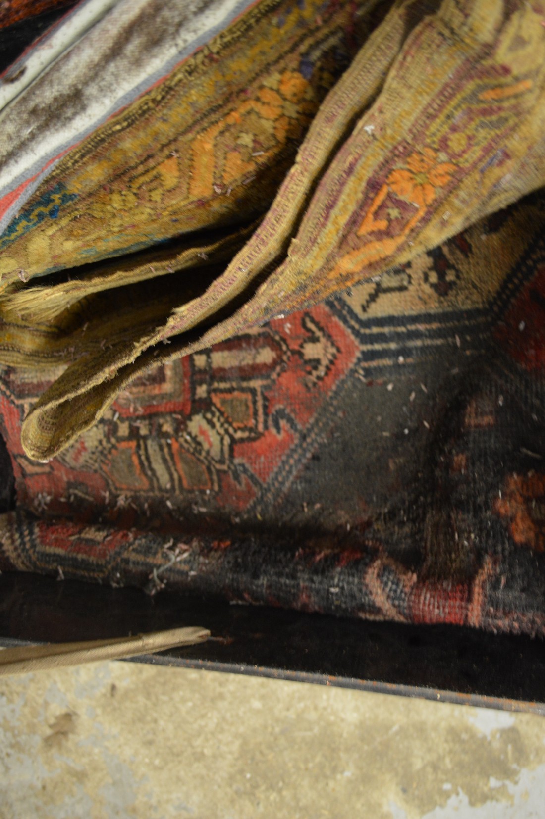 A tin trunk containing various old Persian and other carpets etc (sold as seen). - Image 3 of 3