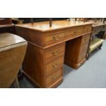 A Victorian walnut pedestal desk.