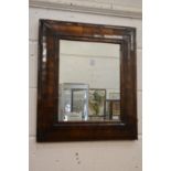 A good period walnut cushion framed mirror.