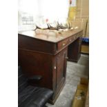 An unusual Edwardian large mahogany twin pedestal clerks desk.