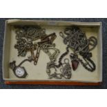 Ladies silver cased watch and various watch chains.