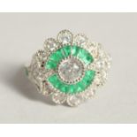 A SILVER DECO STYLE RING WITH CUBIC ZIRCONIA AND EMERALD.