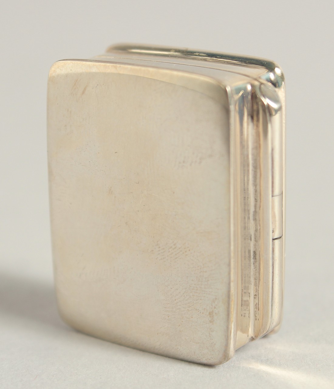 A SILVER AND ENAMEL NUDE PILL BOX, 1.25". - Image 2 of 3