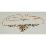 A 9CT GOLD SILVER SET PERIDOT AND DIAMOND NECKLACE.