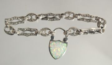 A SILVER OPAL SET BRACELET WITH THISTLE LOCK.