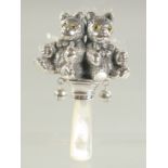 A SILVER AND MOTHER OF PEARL DOUBLE TEDDY RATTLE.
