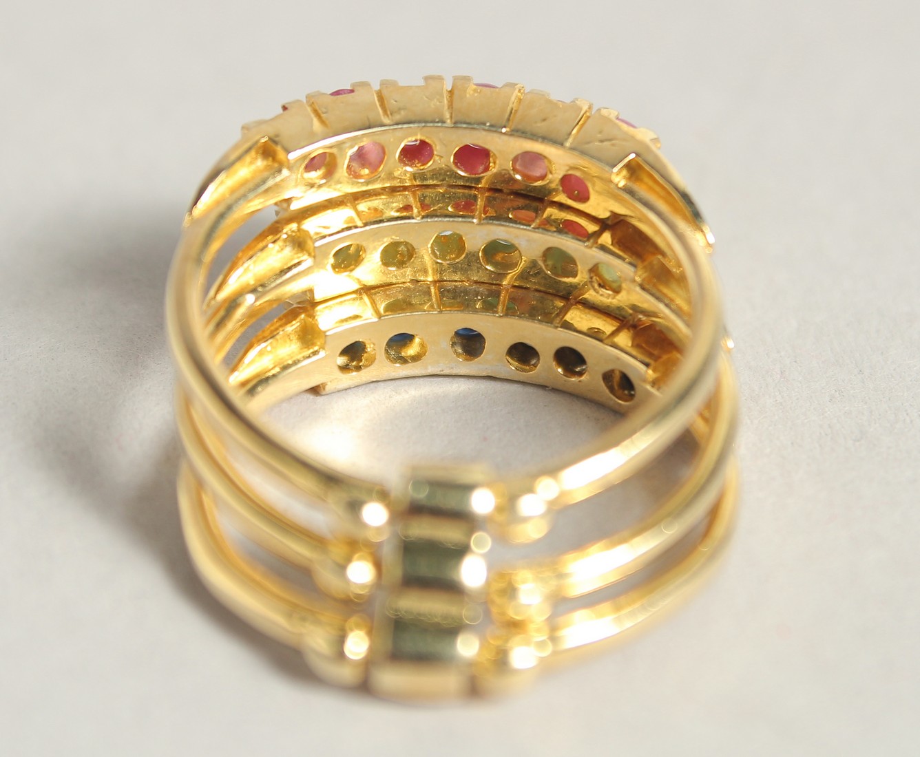 A SILVER AND 18 CT GOLD PLATED SAPPHIRE RUBY AND EMERALD STACK RING. - Image 2 of 2