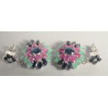 A PAIR OF SILVER RUBY SAPPHIRE AND EMERALD CLUSTER EARRINGS.