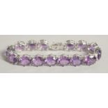 A SILVER BRACELET WITH FIFTEEN REAL AMETHYSTS.