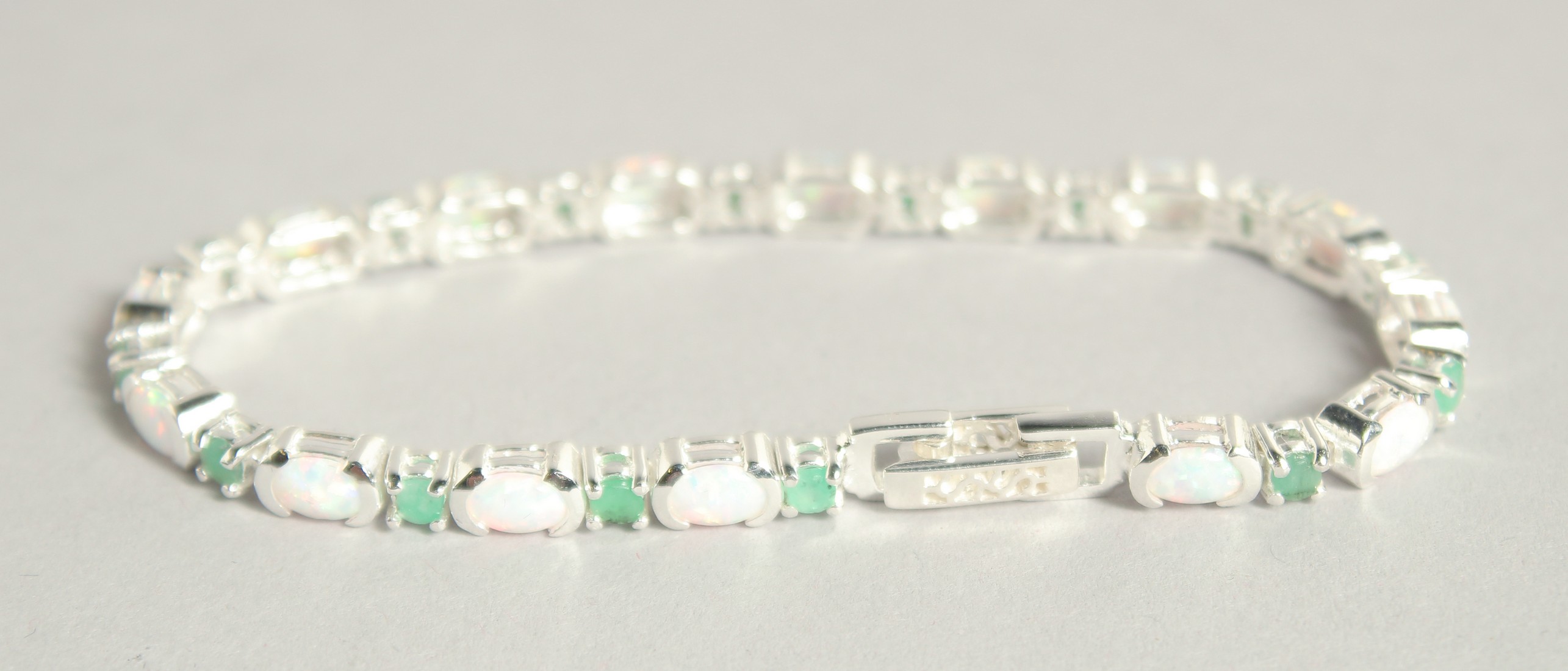 A SILVER OPAL AND EMERALD LINE BRACELET. - Image 2 of 2