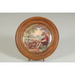 A PORCELAIN POT LID, THE SHEPHERD BOY, 4ins diameter, framed.