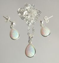 A SILVER NECKLACE AND EARRINGS WITH PEAR SHAPED OPALS.