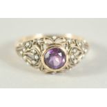 A 9CT. GOLD AMETHYST AND PEARL RING.