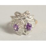 A SILVER AND 18 CT GOLD PLATED AMETHYST SWEETHEART RING.