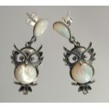 A PAIR OF SILVER AND MOTHER OF PEARL OWL EARRINGS.