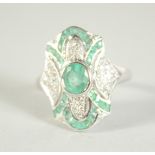 A 9CT. GOLD EMERALD AND DIAMOND DECO STYLE RING.