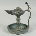 A FINE 12TH-13TH CENTURY PERSIAN SELJUK BRONZE OIL LAMP, with bird-form finial, 19cm high.