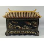 A 19TH CENTURY CHINESE BLACK AND GILT LACQUERED PAGODA CASKET, with roof-formed cover and painted