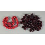 A CORAL BEADED NECKLACE, together with a ruby-colour necklace, (2).