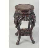 A CHINESE MARBLE INSET CARVED HARDWOOD VASE STAND, with petal-shape top, carved and pierced