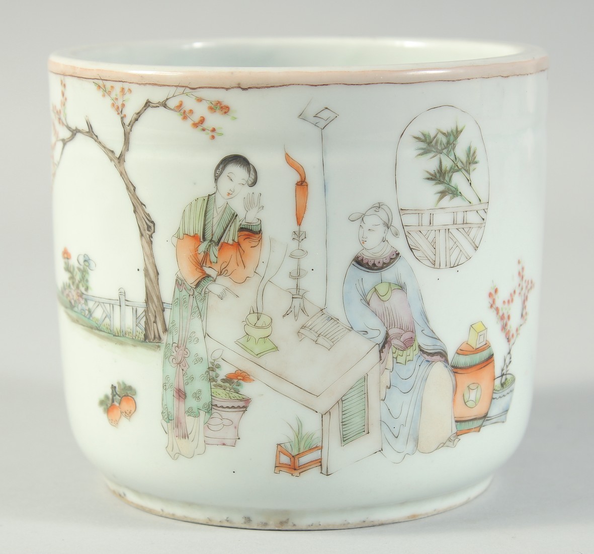 A CHINESE REPUBLIC PORCELAIN BRUSH POT, finely painted with figures in a garden and bearing four-