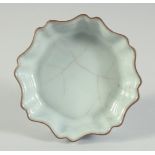 A CHINESE CELADON GLAZE PETAL-FORM BRUSH WASHER, 11.5cm at widest point.