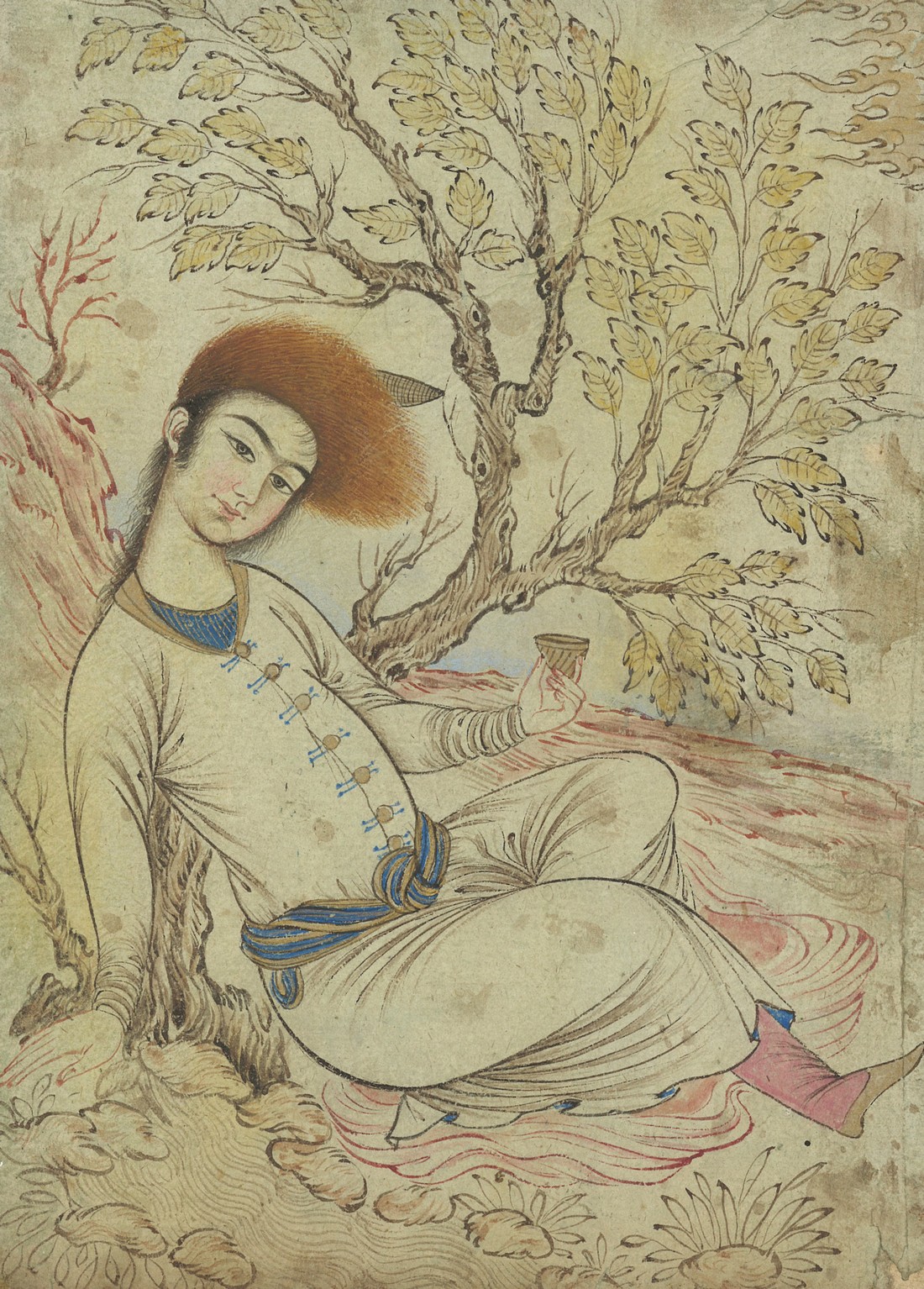 A PERSIAN MINIATURE PAINTING ON PAPER, depicting a seated figure beside a tree with marbled