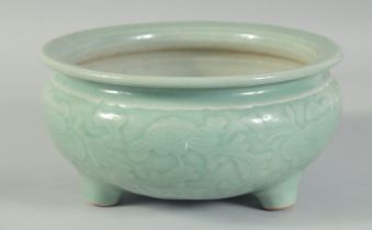 A 19TH CENTURY CHINESE CELADON GLAZE PORCELAIN BOWL / CENSER, with carved floral decoration to the