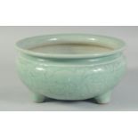 A 19TH CENTURY CHINESE CELADON GLAZE PORCELAIN BOWL / CENSER, with carved floral decoration to the