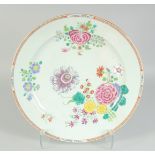 A CHINESE FAMILLE ROSE PORCELAIN CHARGER, finely enamel painted with native flora and gilt