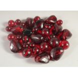 A COLLECTION OF RUBY-COLOUR BEADS, various sizes, (qty).