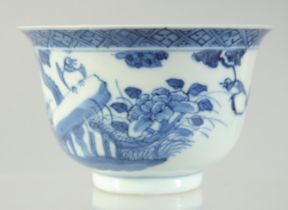 A 19TH CENTURY CHINESE BLUE AND WHITE PORCELAIN TEA BOWL, painted with a bird and flora, the reverse