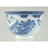 A 19TH CENTURY CHINESE BLUE AND WHITE PORCELAIN TEA BOWL, painted with a bird and flora, the reverse