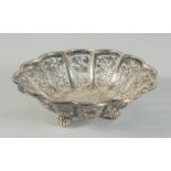 A SMALL CHINESE ENGRAVED AND PIERCED SILVER PETAL FORM DISH, on three ball feet, stamped to base,