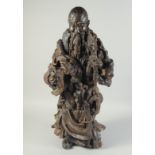 A LARGE NATURALISTIC ROOT WOOD CARVING OF SHOU LAO, 73cm high.