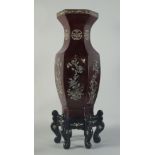 A LARGE CHINESE SHELL INLAID LACQUERED HEXAGONAL VASE, with decorative panels of flora and fauna,