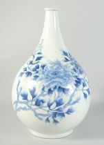 A LARGE 19TH CENTURY JAPANESE ARITA BLUE AND WHITE PORCELAIN VASE, painted with flowers, (base
