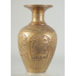 A PERSIAN QAJAR ENGRAVED AND CHASED BRASS VASE, with decorative panels of animals and flora, 26cm